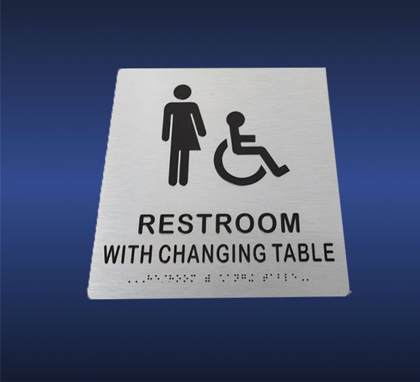 ADA signage for women's restroom with changing table